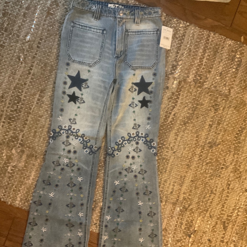 NEW Free people embroidered star flare jeans.